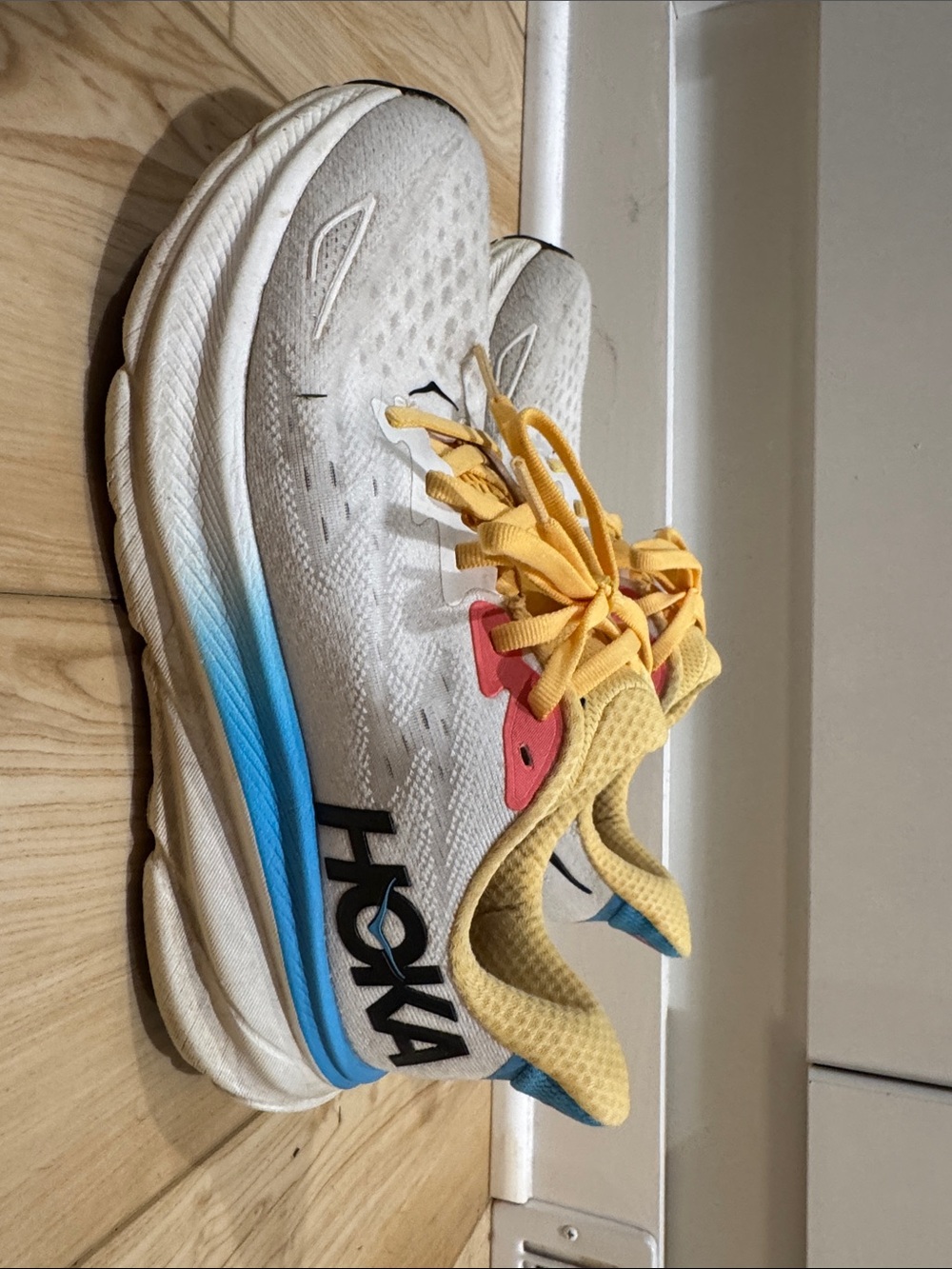 Hoka White Running Shoes with Yellow Laces and Blue Midsole